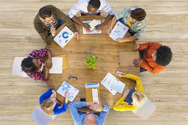 Top down view of round table of partners working at Jigsaw in Liverpool