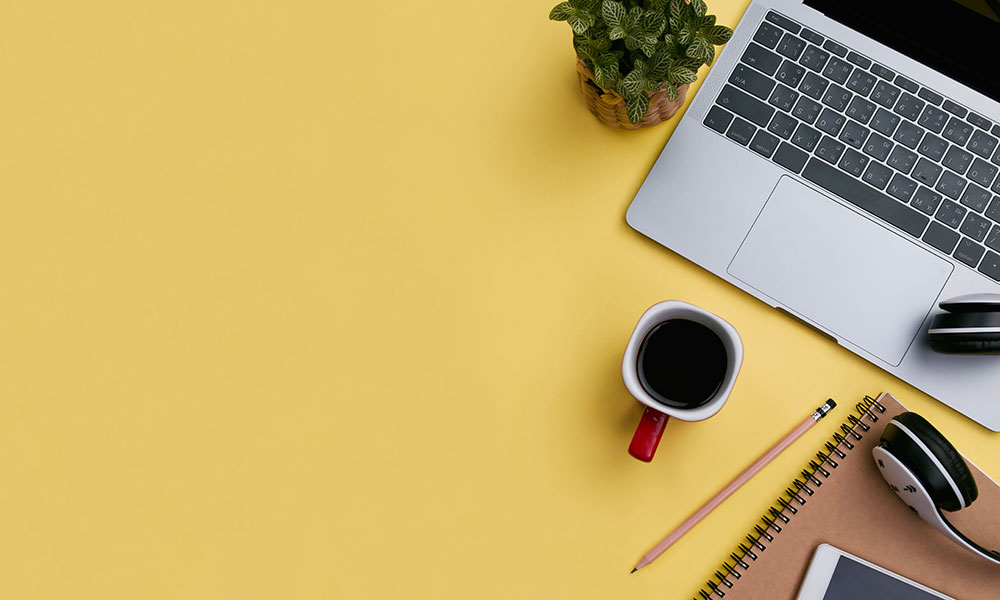 Laptop and coffee mug on desk