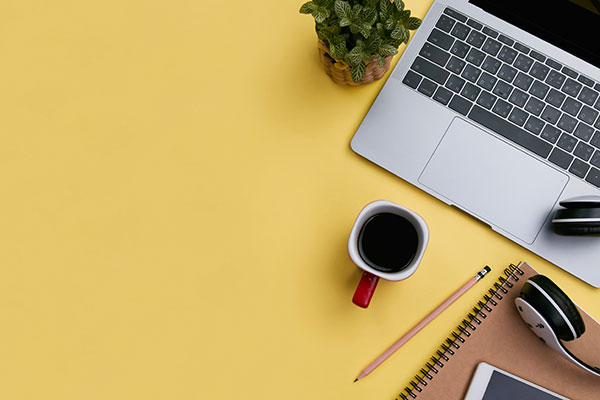 Laptop and coffee mug on desk